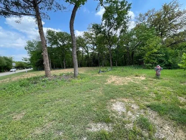 a view of outdoor space with deck and yard