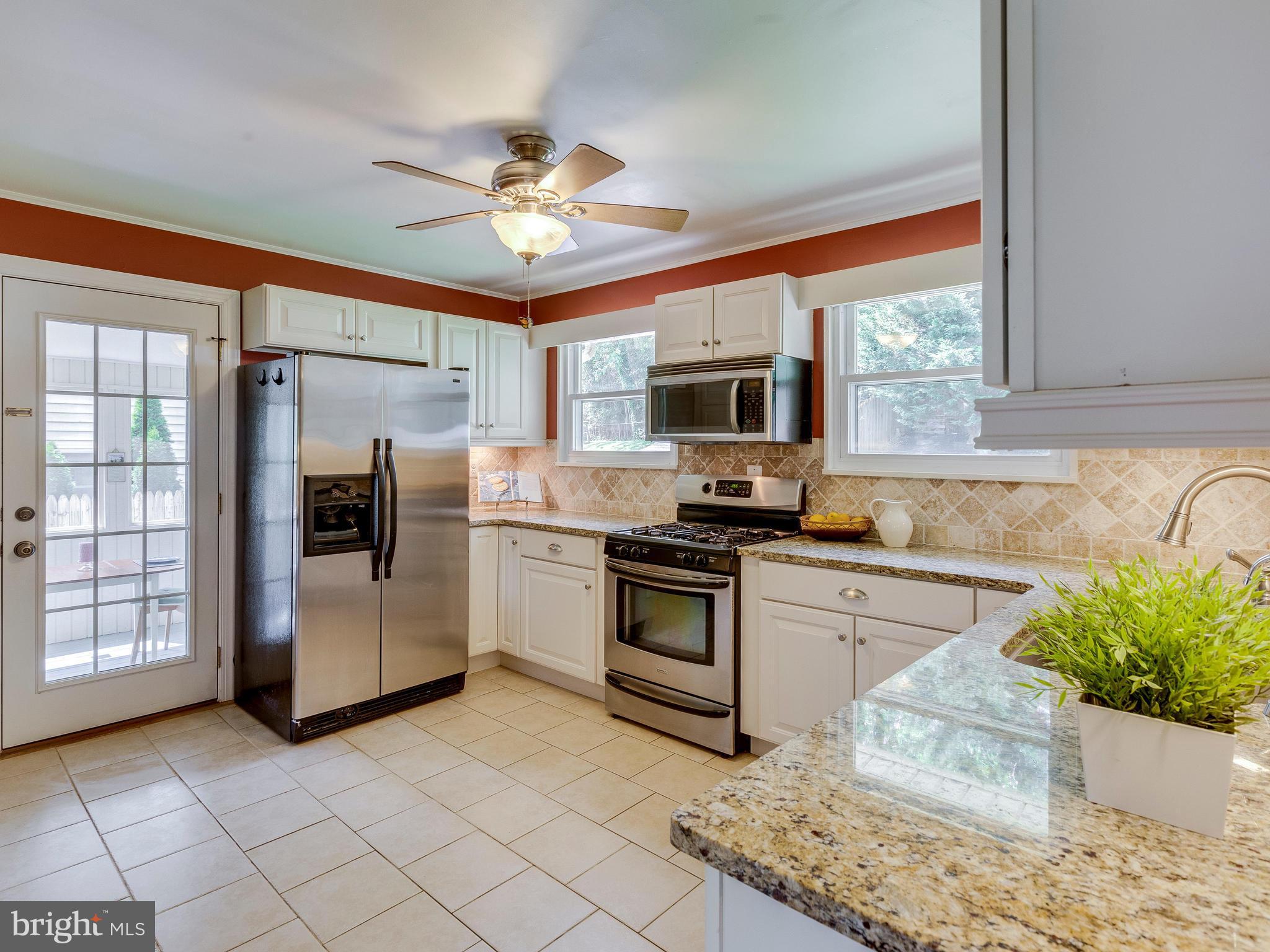 913 Robin Road Silver Spring, MD 20901 - Photo 9 of 30 Ceiling fan/light combo in kitchen