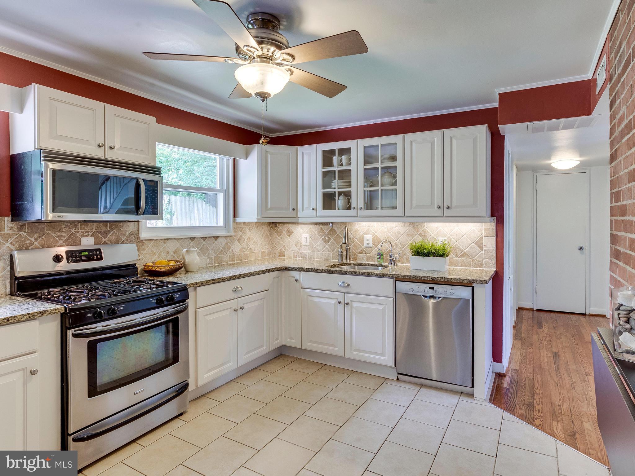 913 Robin Road Silver Spring, MD 20901 - Photo 10 of 30 Updated kitchen with tile backsplash