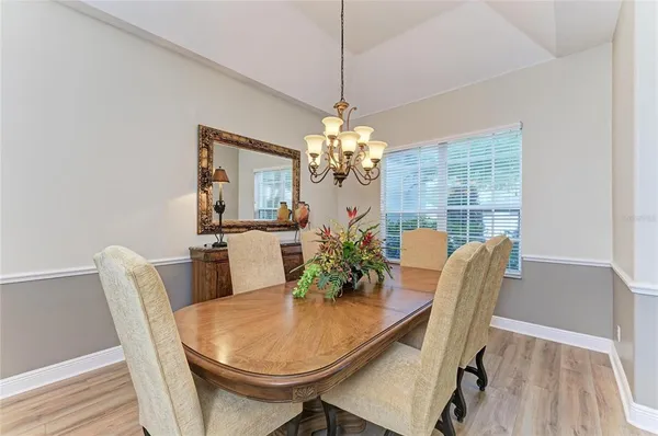 a large kitchen with stainless steel appliances granite countertop a sink stove and refrigerator