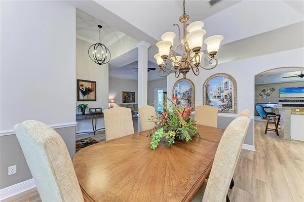 a kitchen with granite countertop a sink stove and cabinets