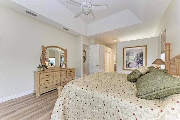 a bedroom with a bed and a chair