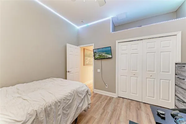 a bedroom with a bed and a dresser