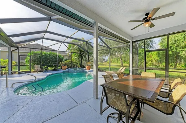 an aerial view of residential house with outdoor space and swimming pool