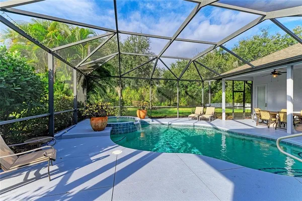 a view of a garden with an outdoor seating