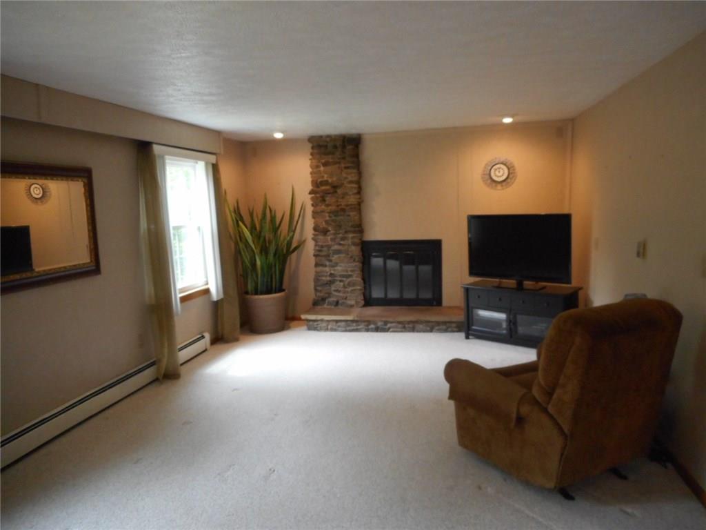 182 Adamson Road Marianna, PA 15345 - Photo 4 of 24 LIVING ROOM WITH GAS FIREPLACE