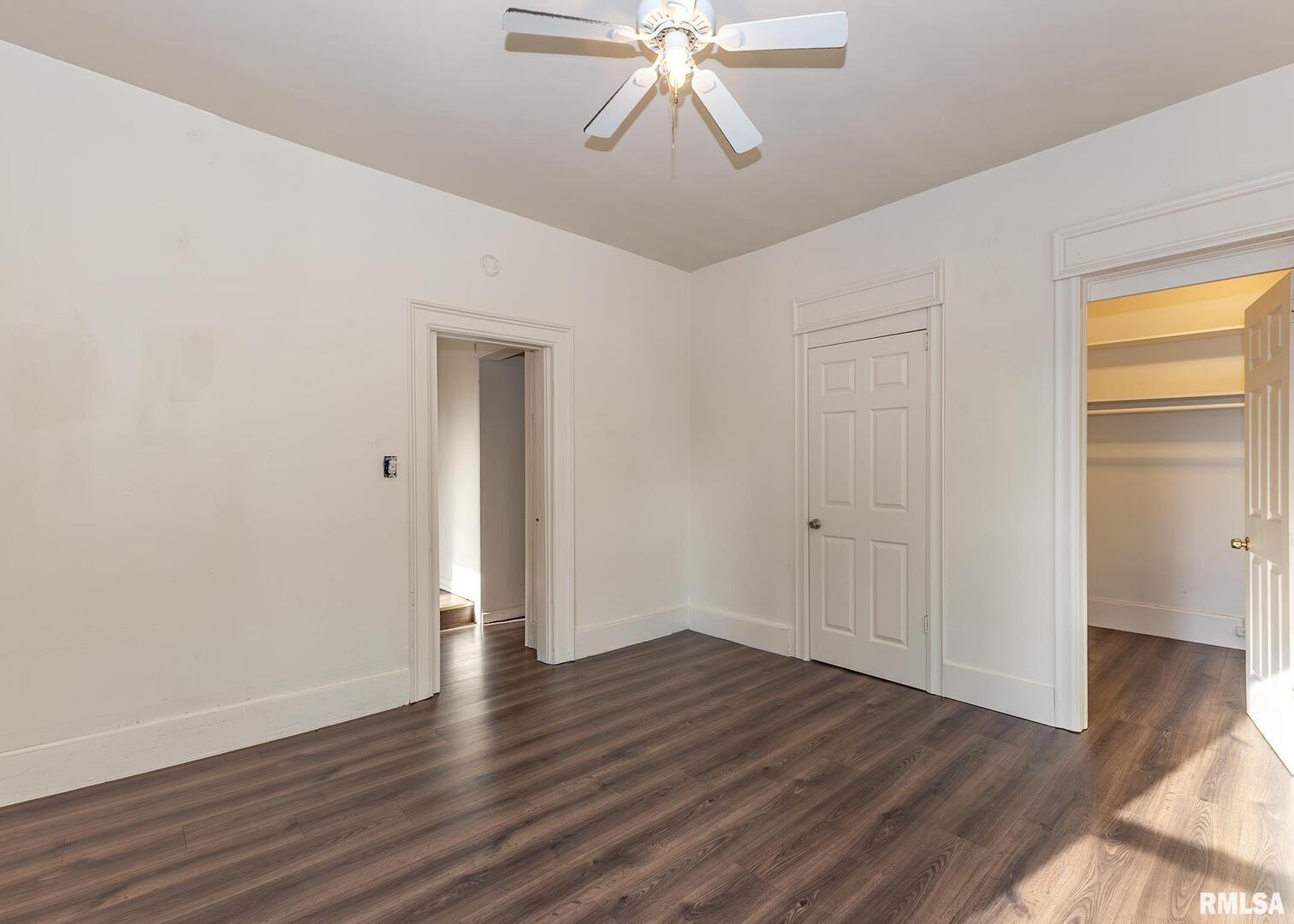 633 7th Avenue South Clinton, IA 52732 - Photo 12 of 19 a view of an empty room with wooden floor