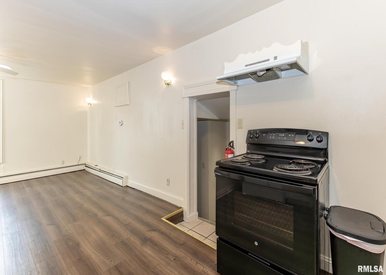 633 7th Avenue South Clinton, IA 52732 - Photo 16 of 19 a kitchen with a stove and a microwave