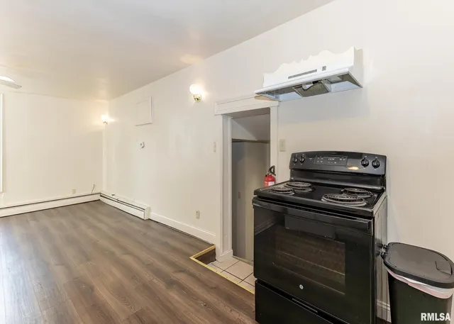 a kitchen with a stove and a microwave