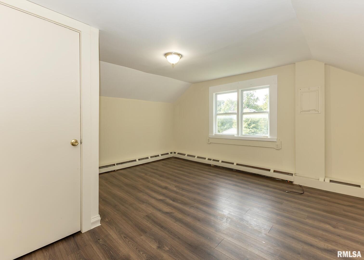 633 7th Avenue South Clinton, IA 52732 - Photo 17 of 19 an empty room with wooden floor and windows