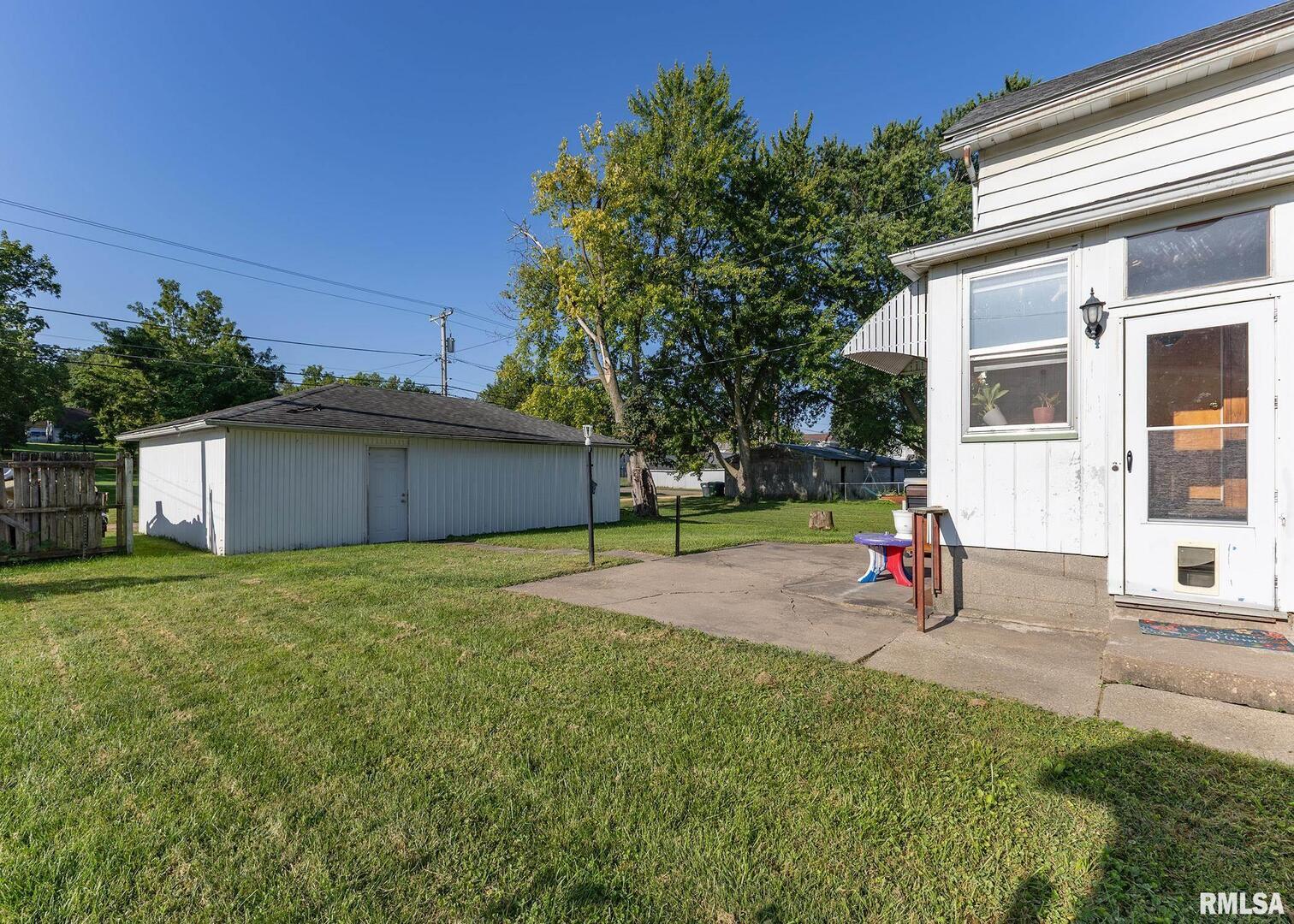 633 7th Avenue South Clinton, IA 52732 - Photo 5 of 19 a view of a backyard with a garden and plants