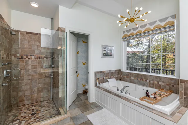 a view of a chair and window in a room