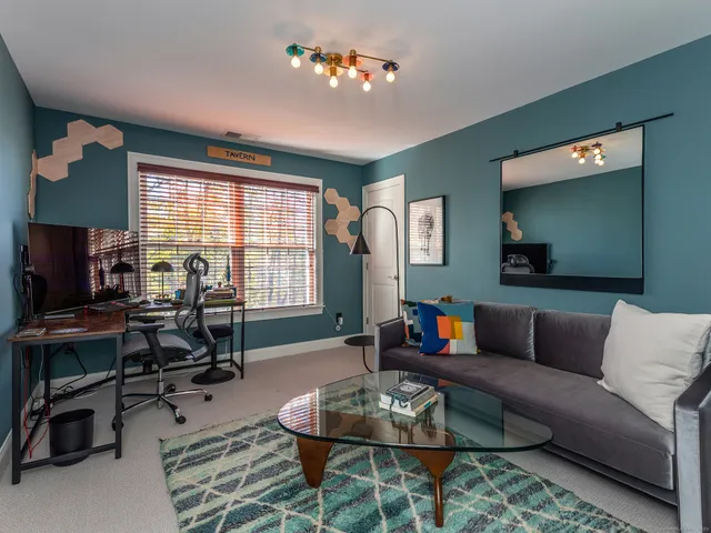 a bathroom with a sink a toilet and shower curtain