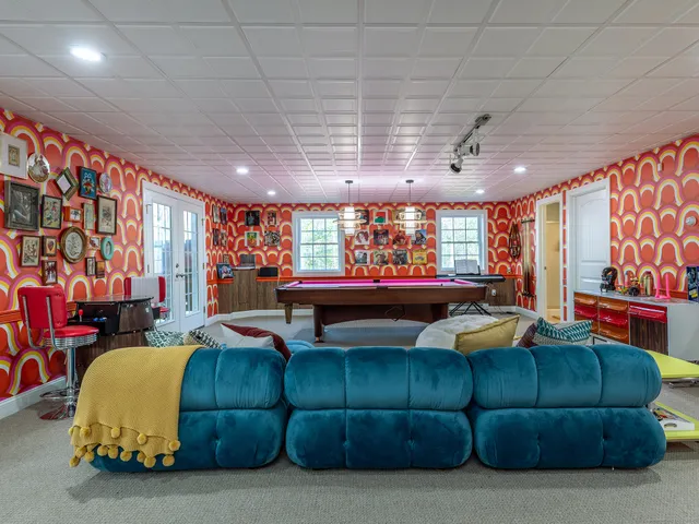 a room with pool table and flat screen tv