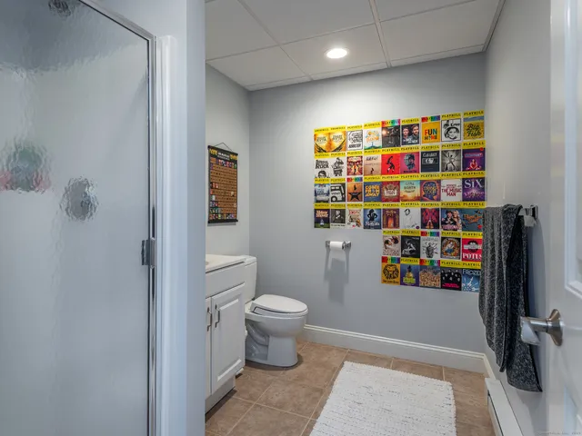 a view of a tree in a yard with potted plants