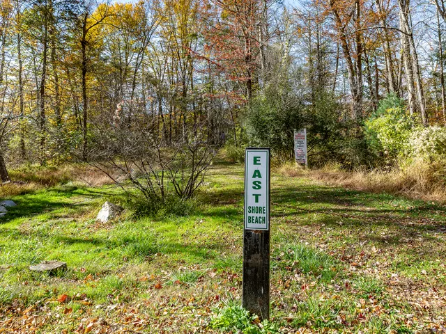 an aerial view of a houses with a lake view