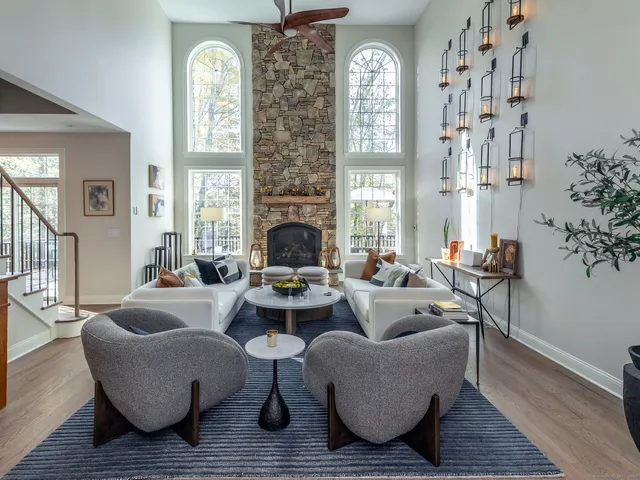 a living room with furniture and a fireplace