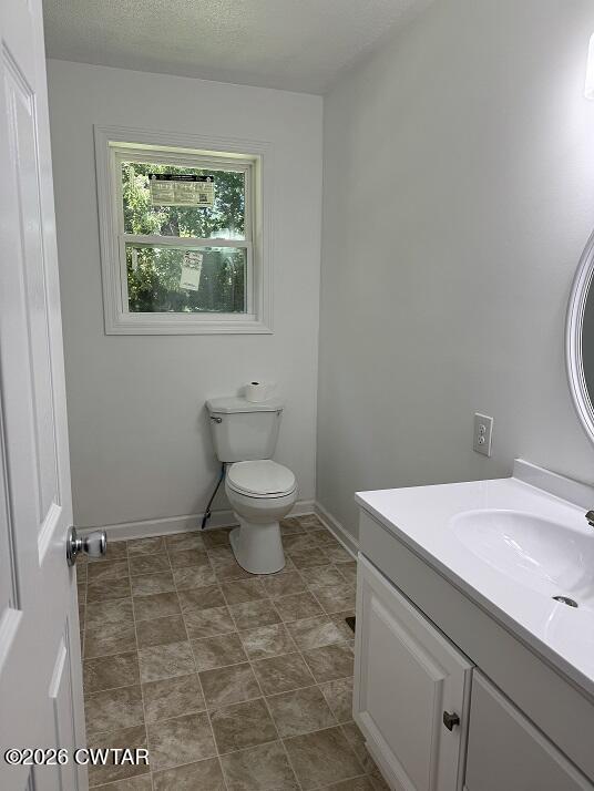 5 Clearview Avenue Trezevant, TN 38258 - Photo 11 of 17 a bathroom with a toilet sink and window