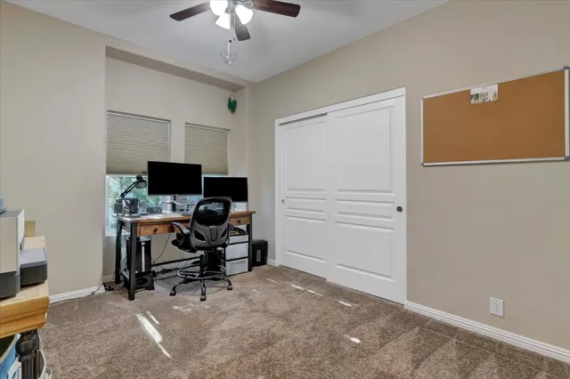 a view of a workspace with furniture