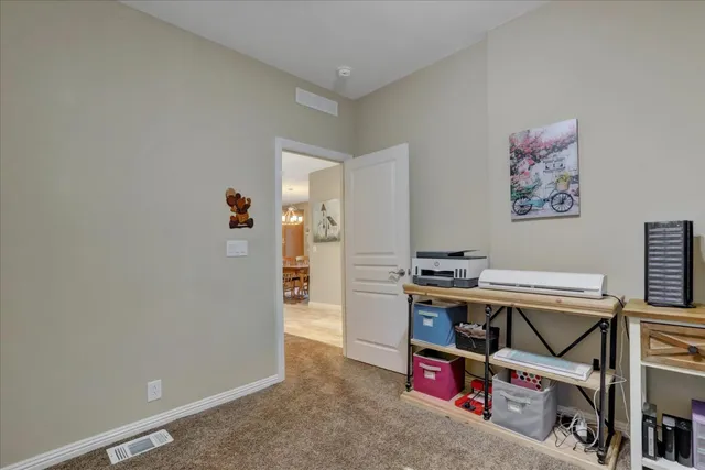 a view of an empty room with storage