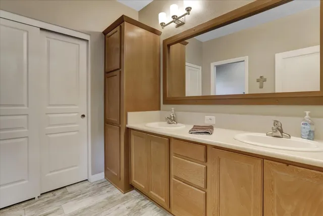 a bathroom with a sink and a mirror