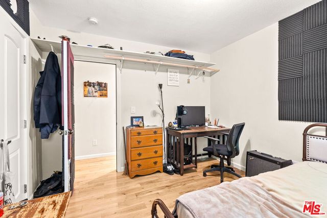 a bedroom with furniture and a window