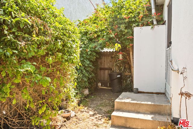a view of a backyard of the house