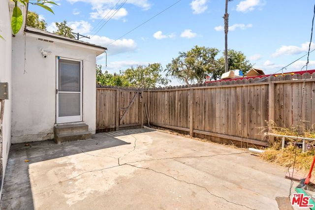 a aerial view of a house with a yard and plants