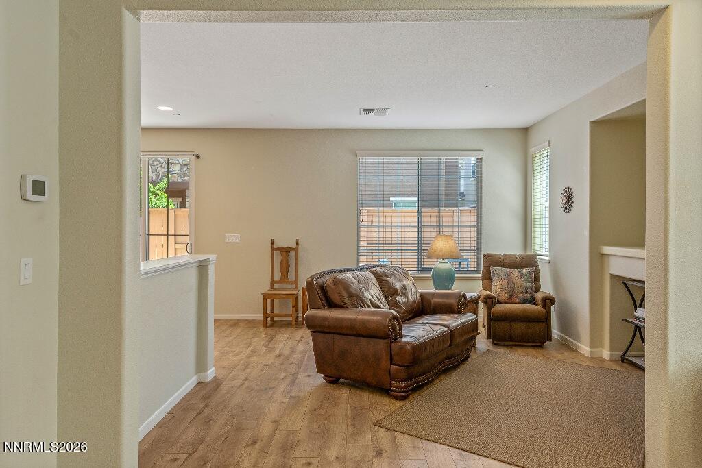 1864 Wind Ranch Road, Unit B Reno, NV 89521 - Photo 9 of 42 a living room with furniture and a window
