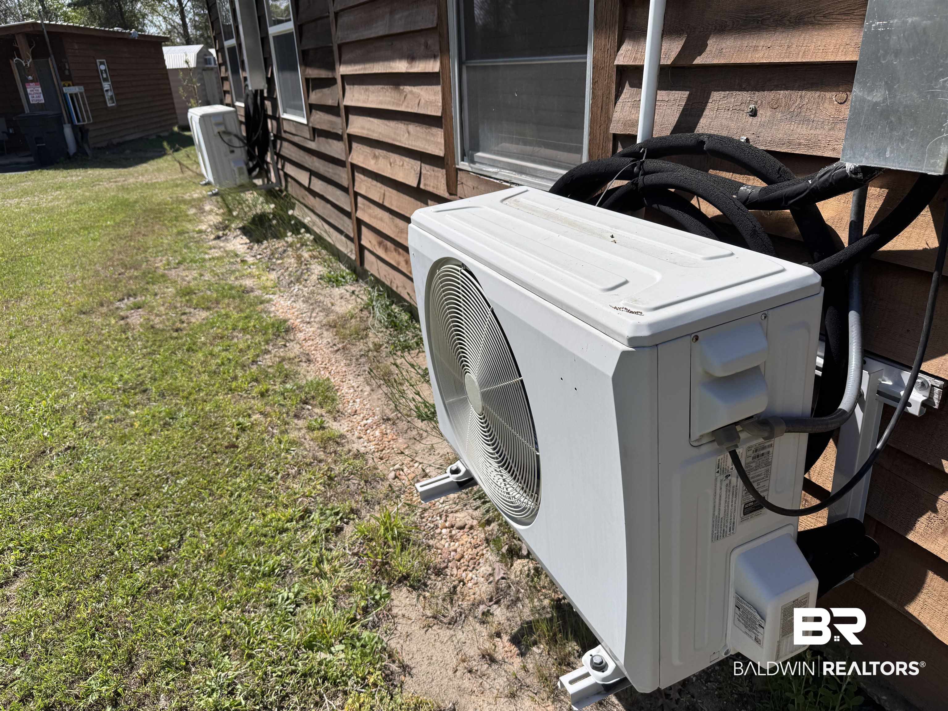 516 Mill Creek Road Frisco City, AL 36445 - Photo 20 of 32 Exterior view of an ac unit and a cooling unit