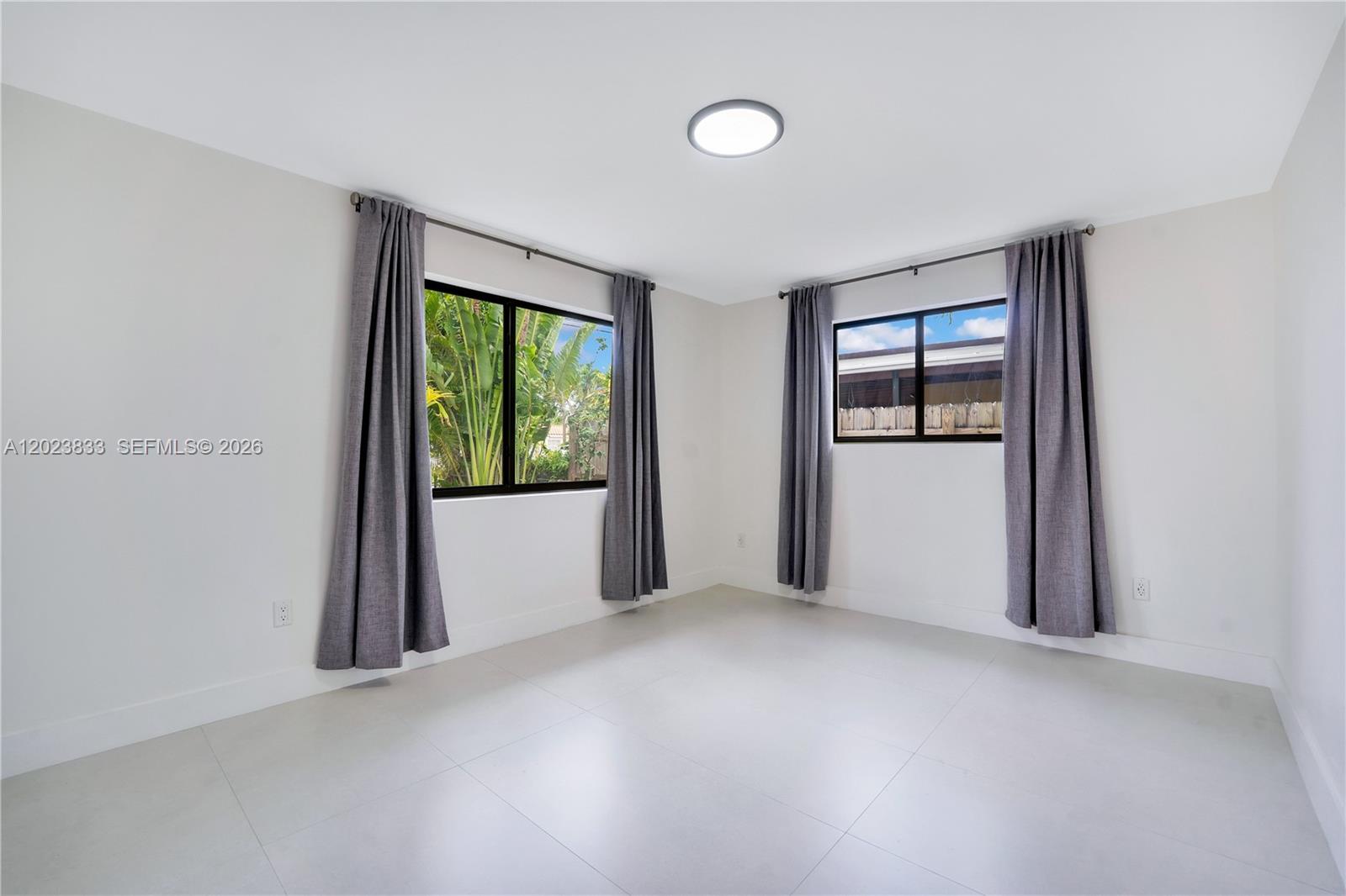 6566 Southwest 35th Street Miami, FL 33155 - Photo 15 of 36 an empty room with windows