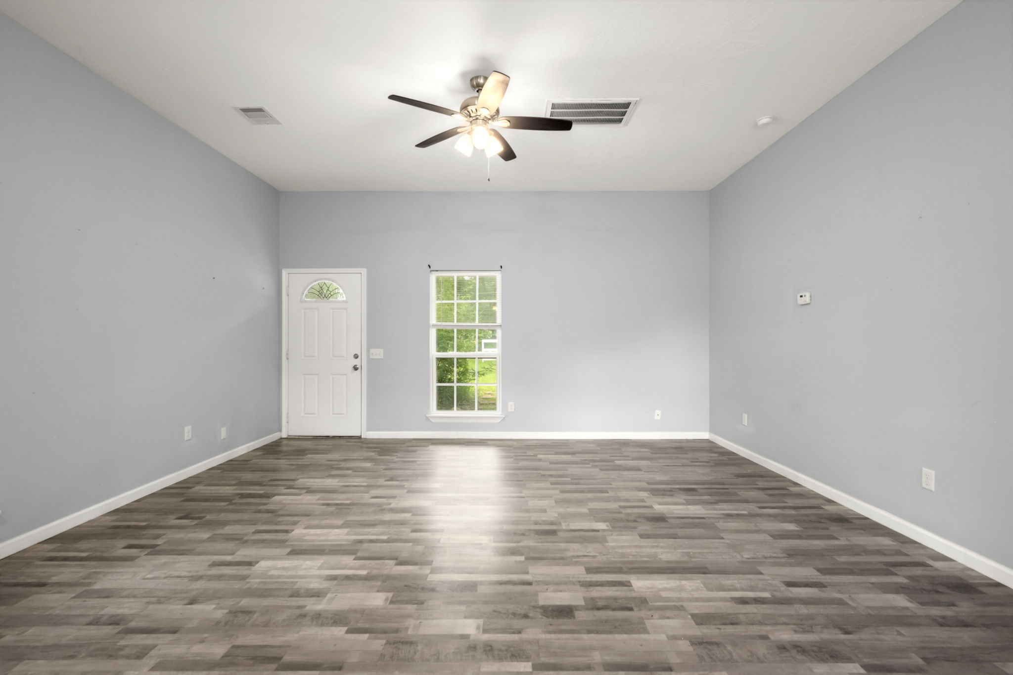 10871 Coaster Lane Conroe, TX 77306 - Photo 21 of 37 Main living area, opens to kitchen, breakfast/ dinning area which is behind where you are standing.