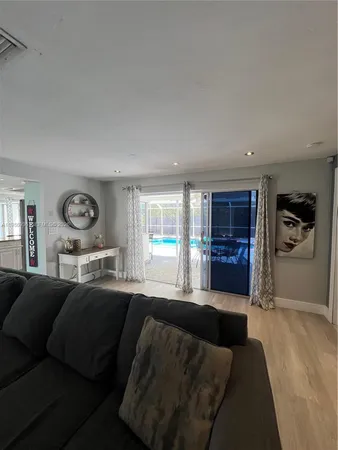 a living room with a couch and a large window