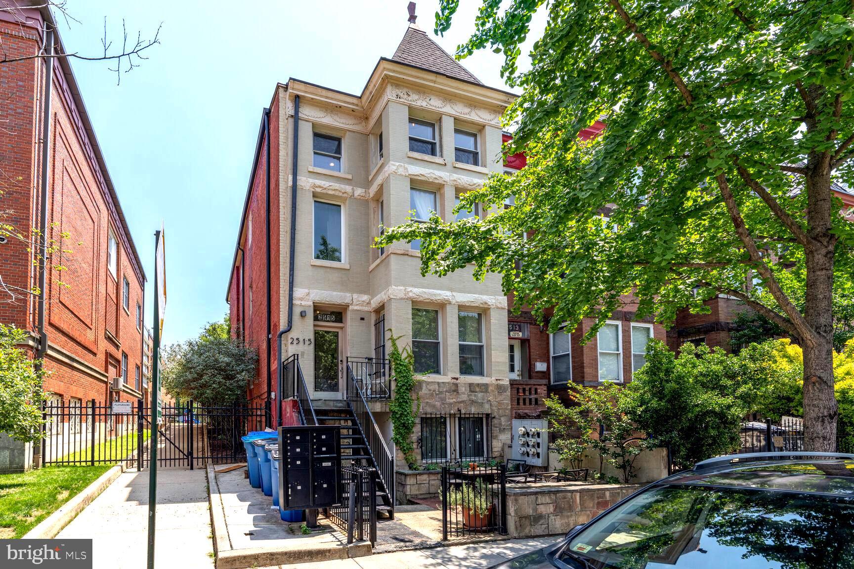 2515 17th Street Northwest, Unit 5 Washington, DC 20009 - Photo 13 of 14 a front view of a residential apartment building with a yard