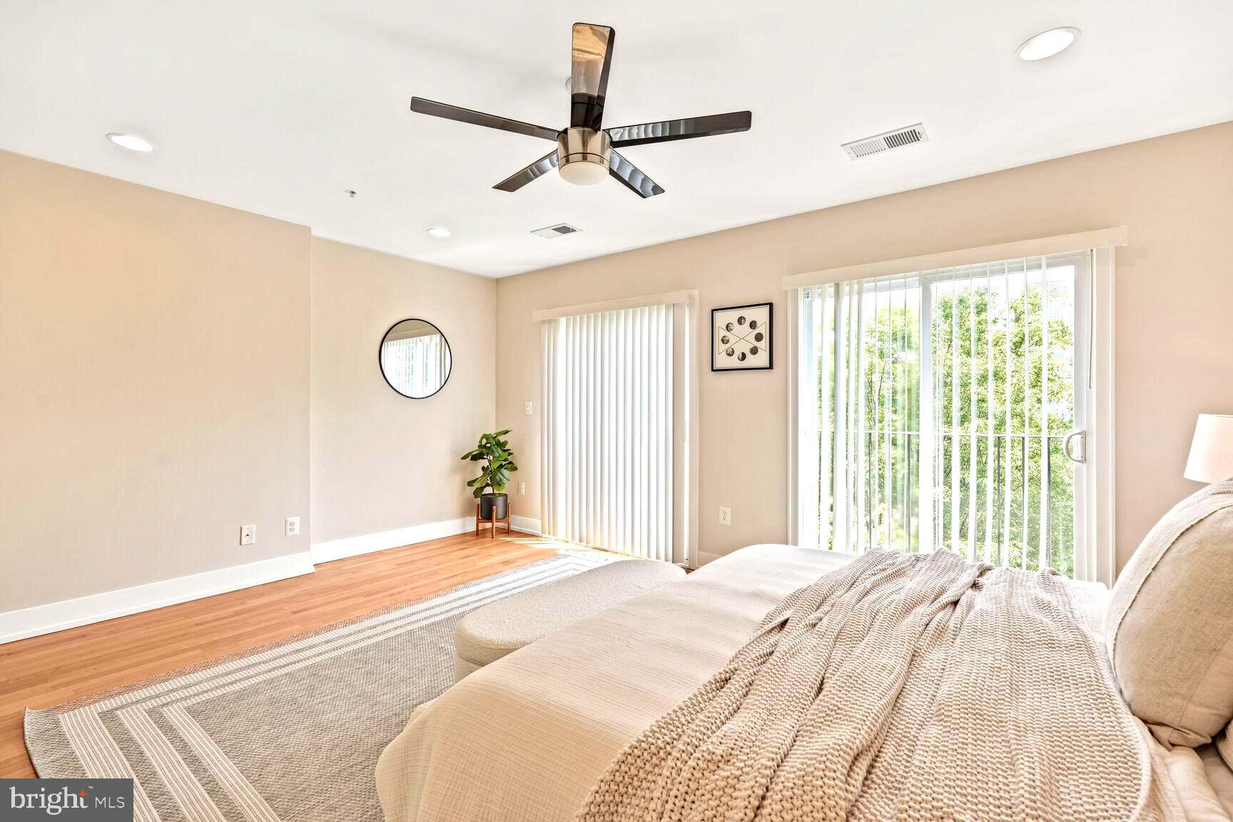 2515 17th Street Northwest, Unit 5 Washington, DC 20009 - Photo 7 of 14 a bedroom with a bed and a large window