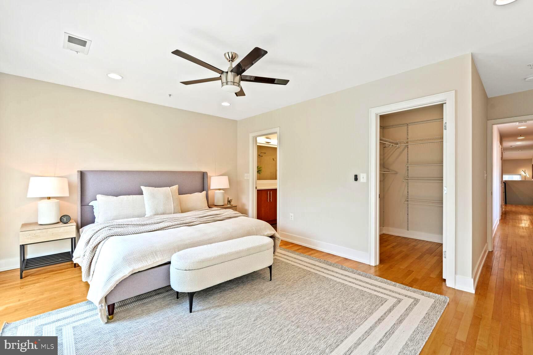 2515 17th Street Northwest, Unit 5 Washington, DC 20009 - Photo 8 of 14 a bedroom with a bed and wooden floor