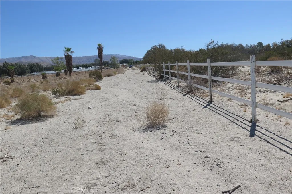 0 Aurora Road Riverside, CA 92504 - Photo 15 of 27 a view of a dry yard with wooden fence