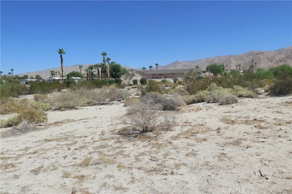 0 Aurora Road Riverside, CA 92504 - Photo 17 of 27 a view of a dry yard with mountains in the background