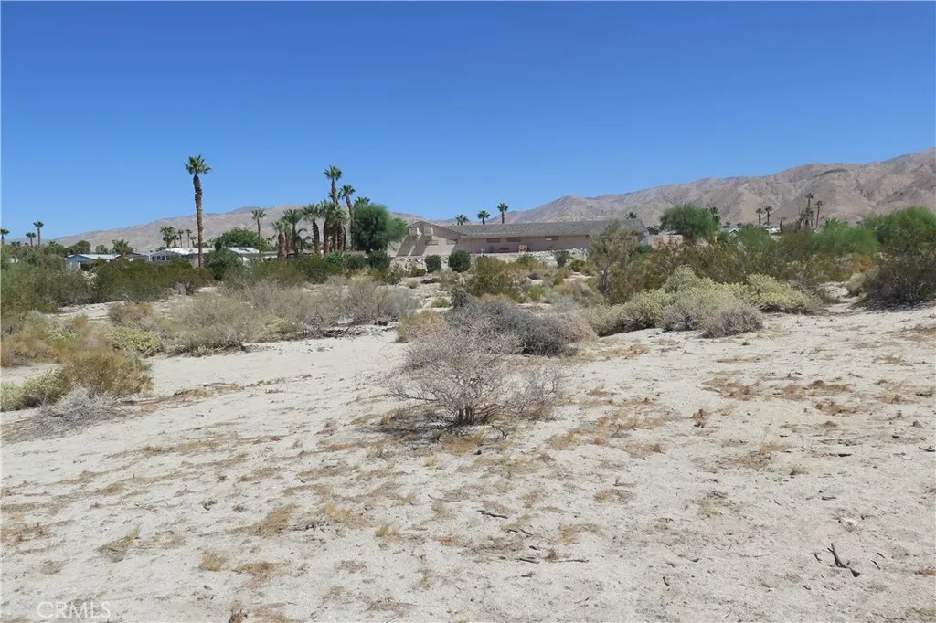 0 Aurora Road Riverside, CA 92504 - Photo 17 of 27 a view of a dry yard with mountains in the background