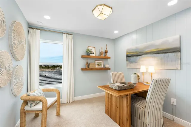 a dining room with furniture and a window