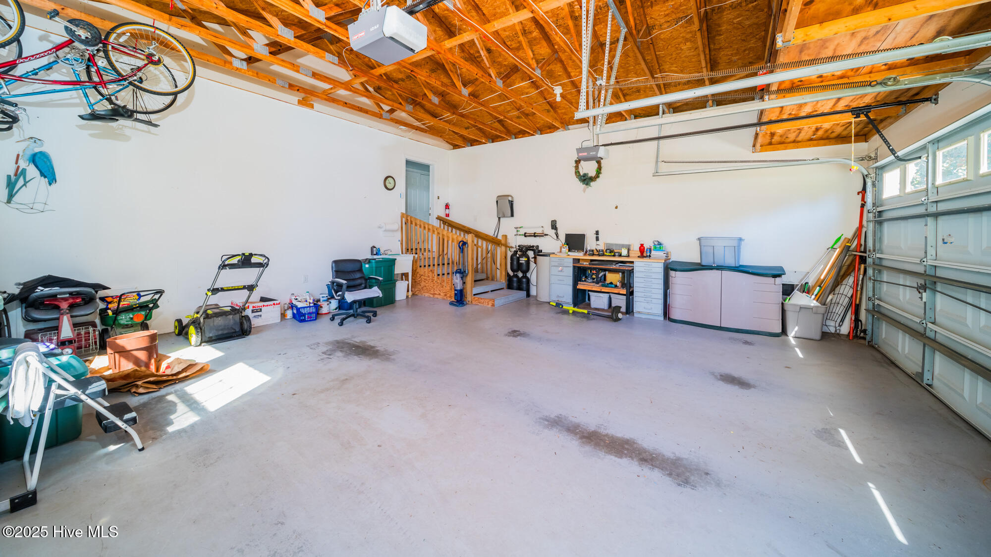 978 Palmer Drive Calabash, NC 28467 - Photo 24 of 30 Large garage with extra overhead storage.