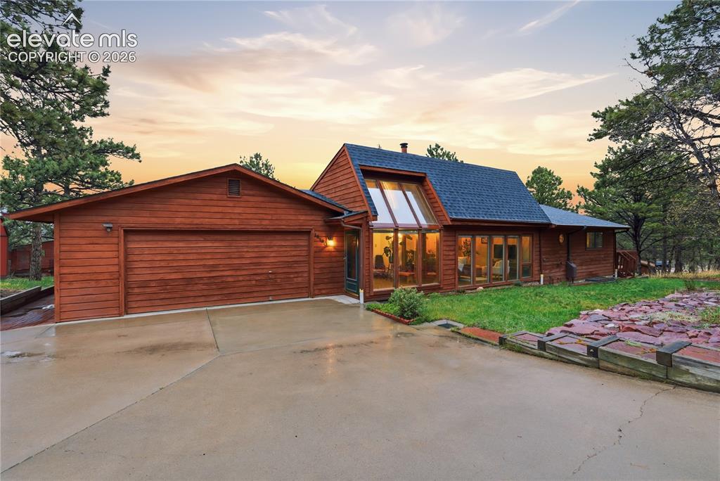 front view of a house with a yard