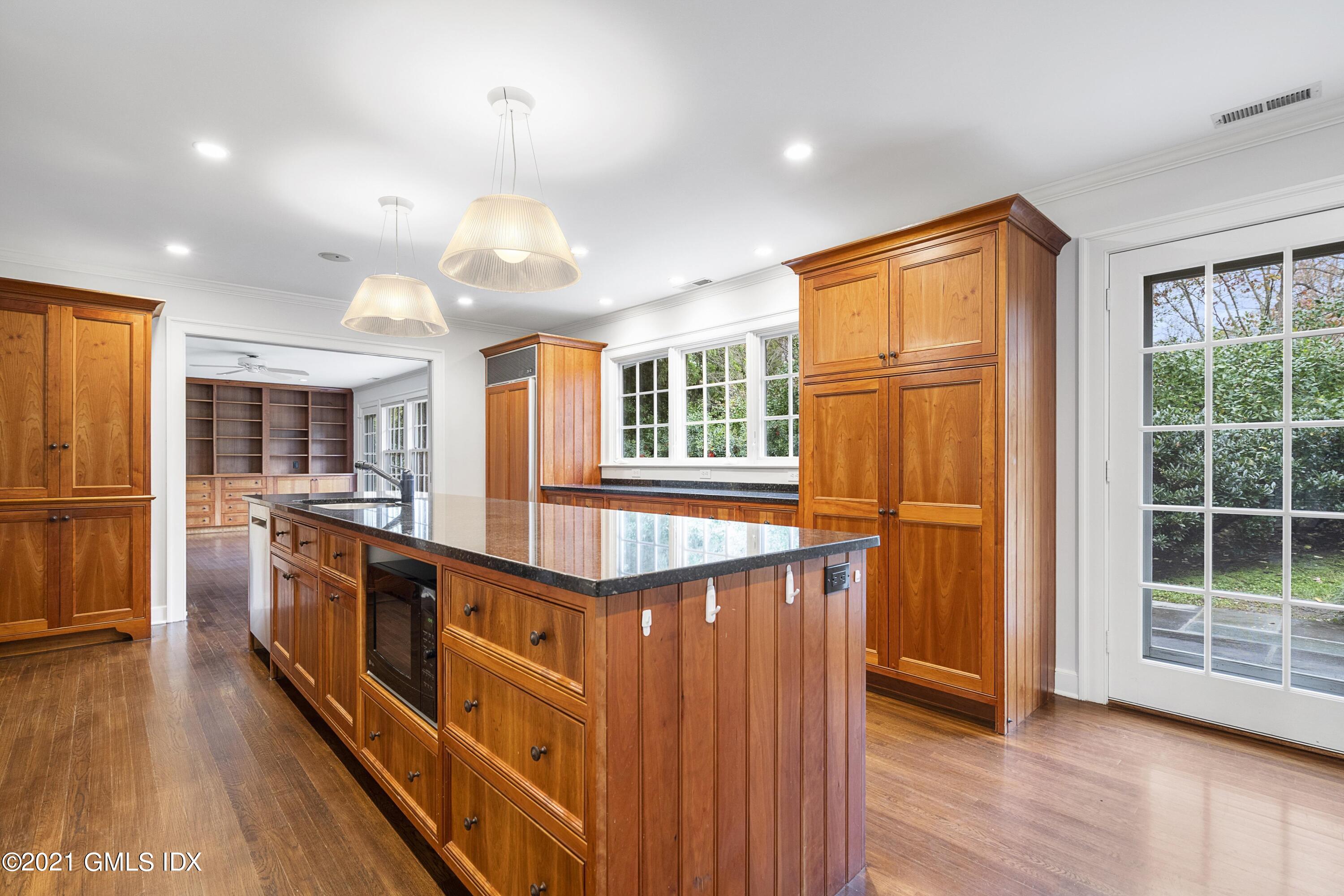 42 Indian Head Road Riverside, CT 06878 - Photo 8 of 47 a view of kitchen with cabinets and wooden floor