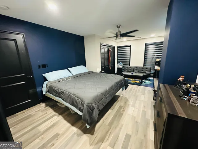 a bedroom with a bed and dresser