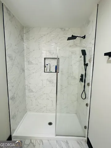 a bathroom with a toilet a sink and a mirror