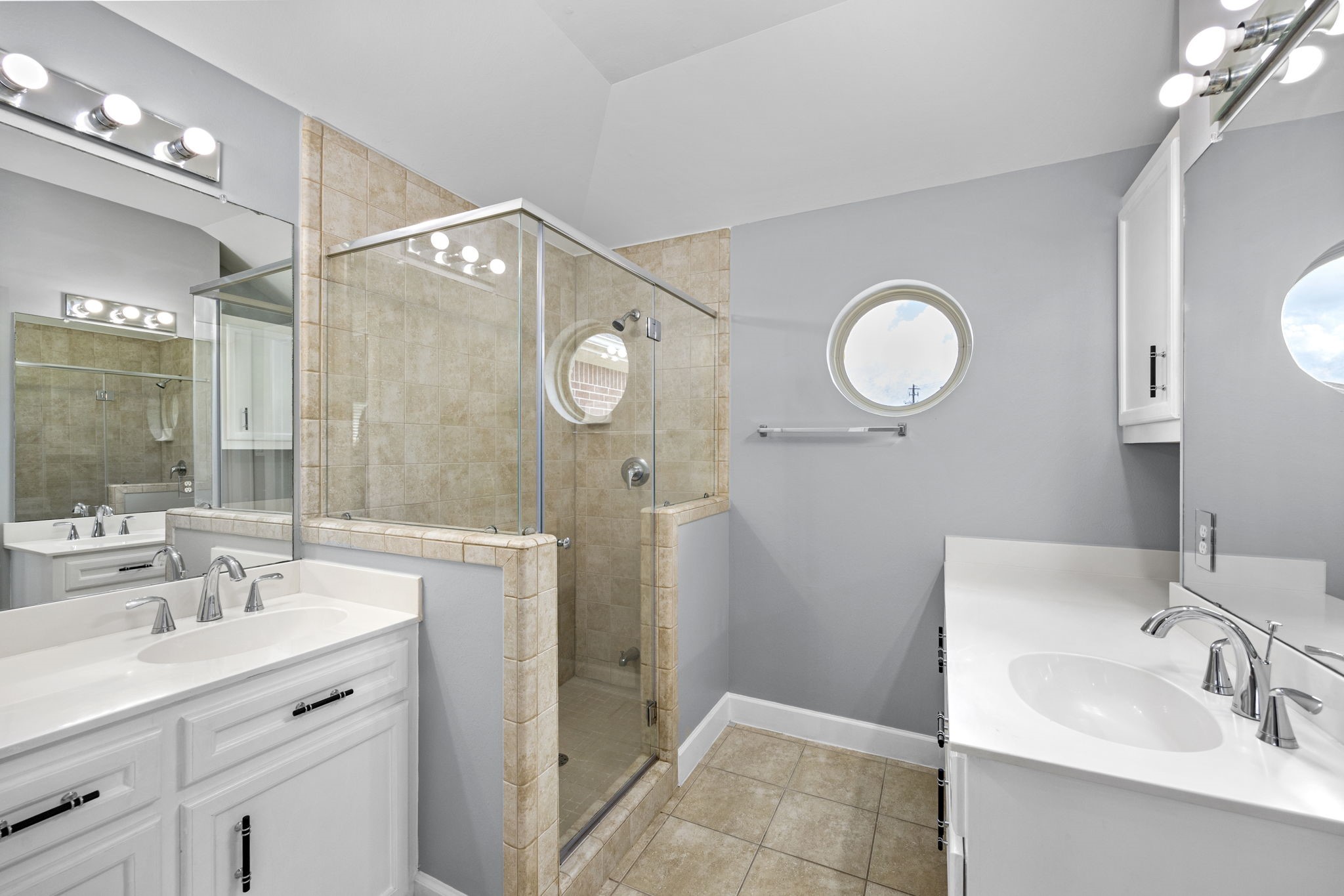 5951 S Loop East, Unit 50 Houston, TX 77033 - Photo 16 of 23 a bathroom with a sink mirror and a shower