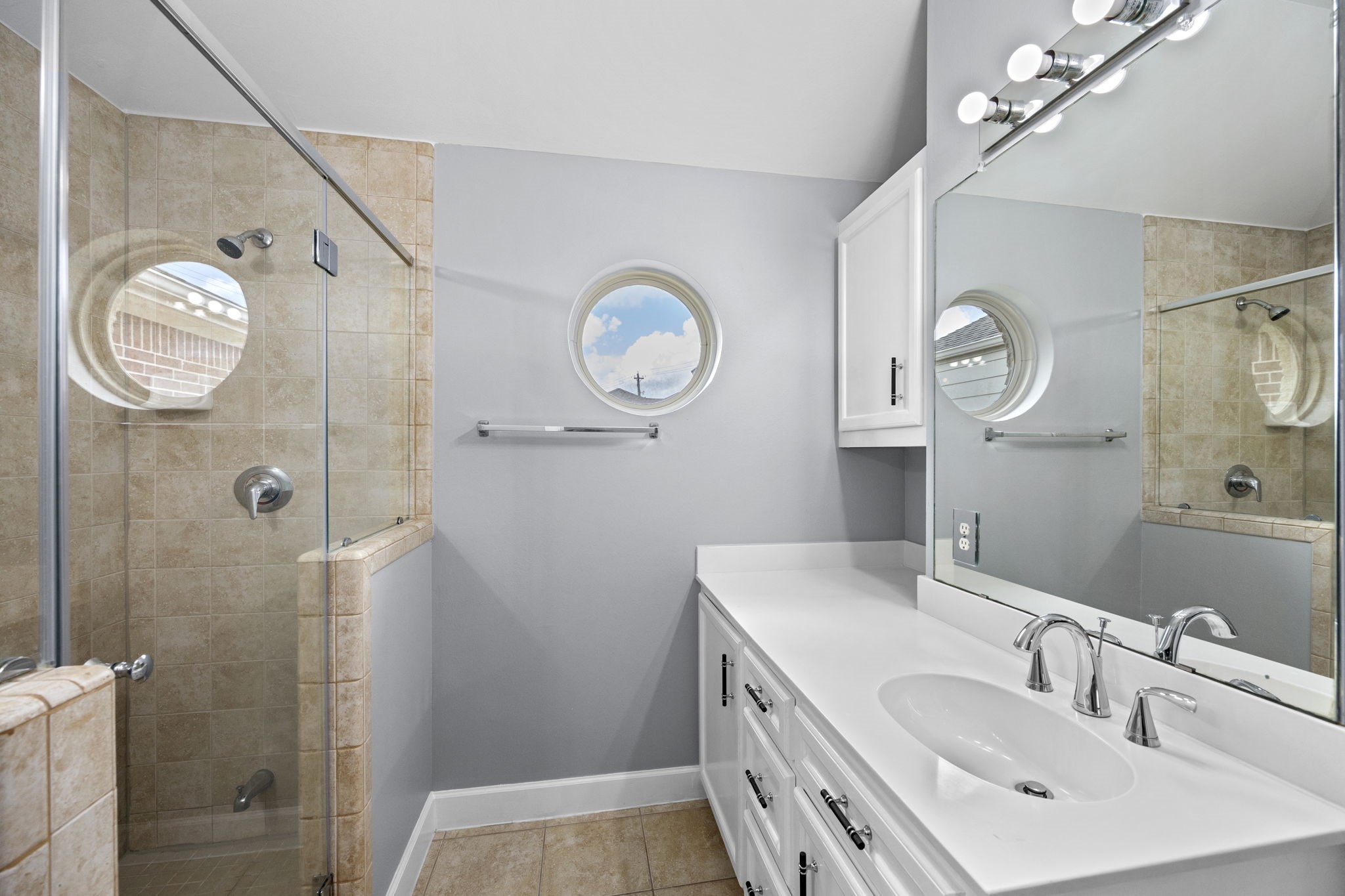 5951 S Loop East, Unit 50 Houston, TX 77033 - Photo 17 of 23 a bathroom with a sink a toilet and a mirror