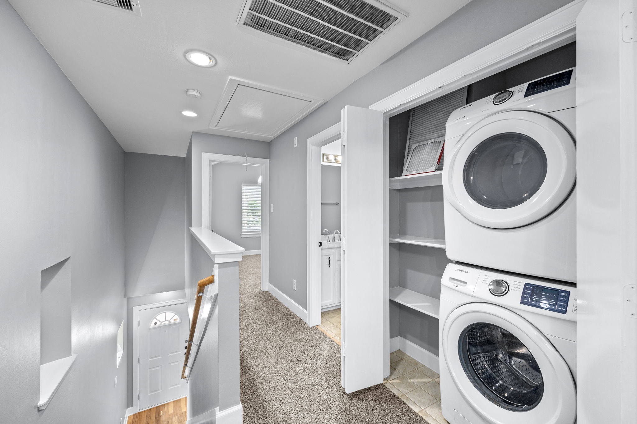 5951 S Loop East, Unit 50 Houston, TX 77033 - Photo 19 of 23 a view of a hallway with washer and dryer