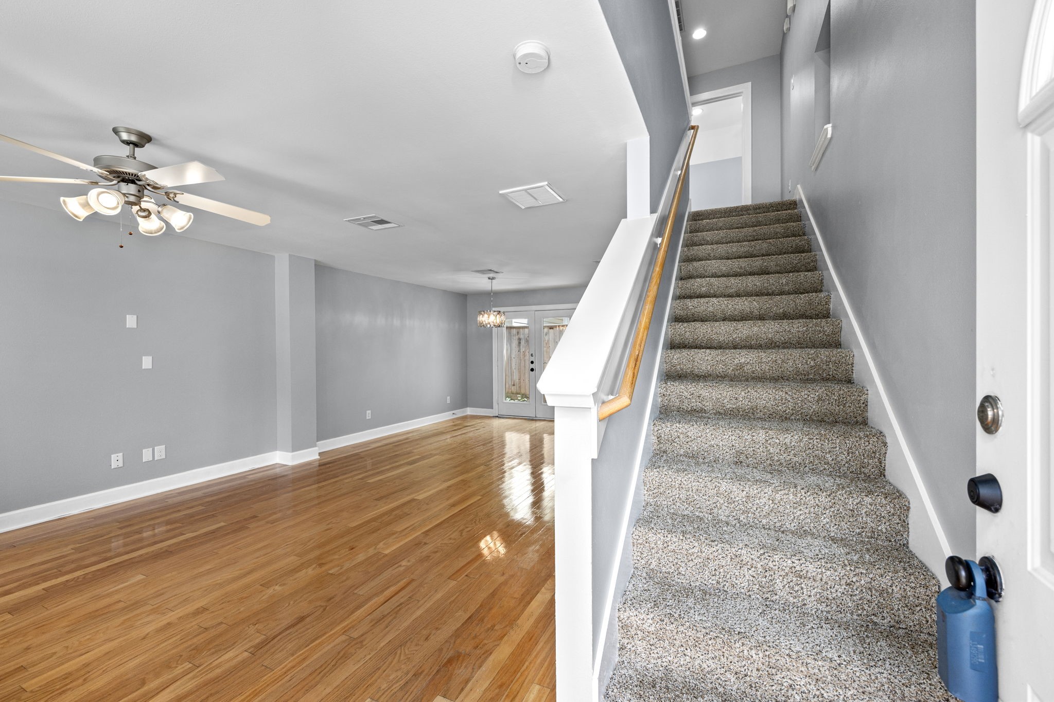 5951 S Loop East, Unit 50 Houston, TX 77033 - Photo 4 of 23 a view of entryway and hall with wooden floor