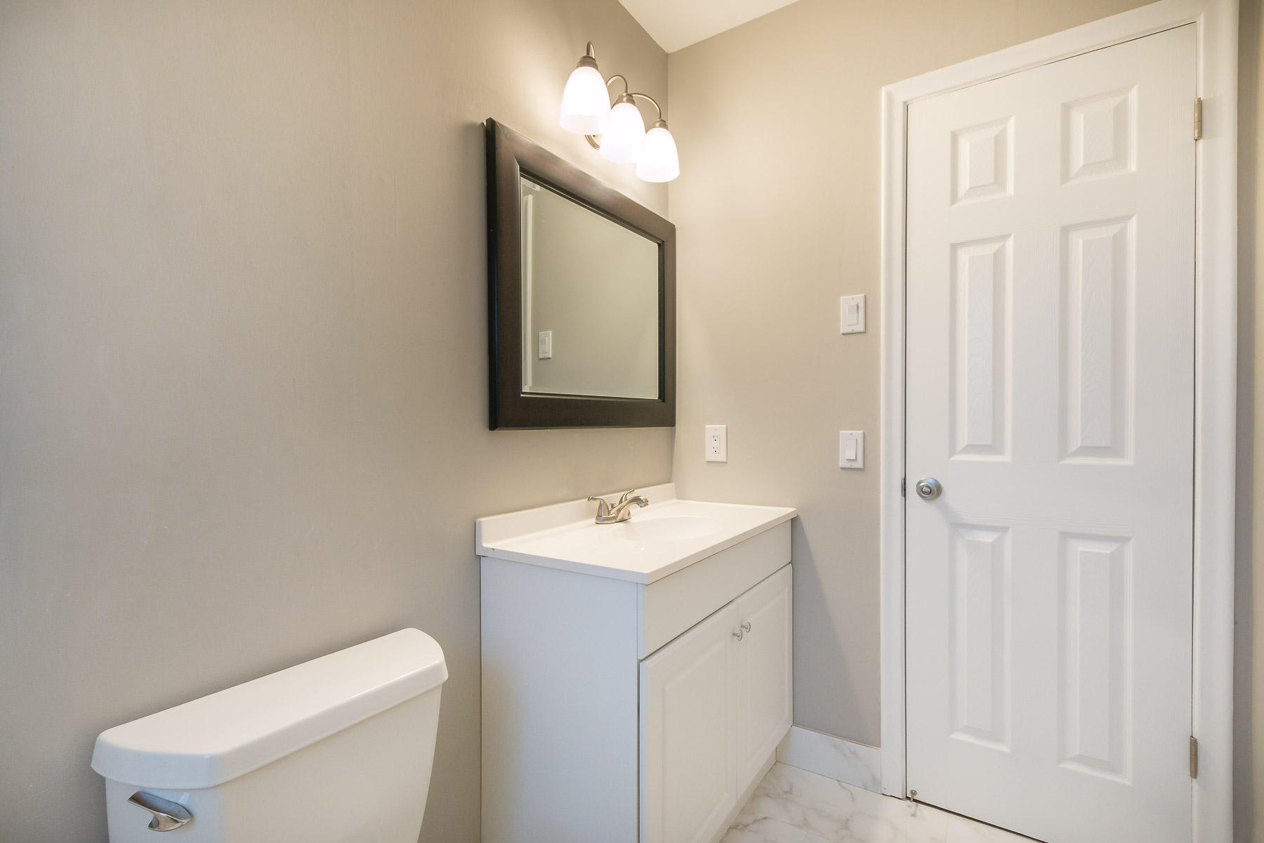 9222 Southwest 1st Place Boca Raton, FL 33428 - Photo 12 of 23 a bathroom with a toilet sink and mirror